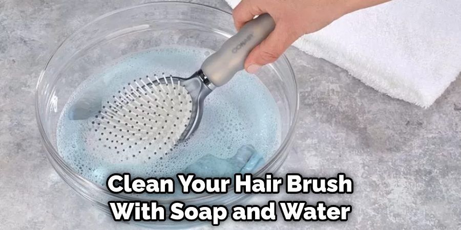 Clean Your Hair Brush With Soap and Water