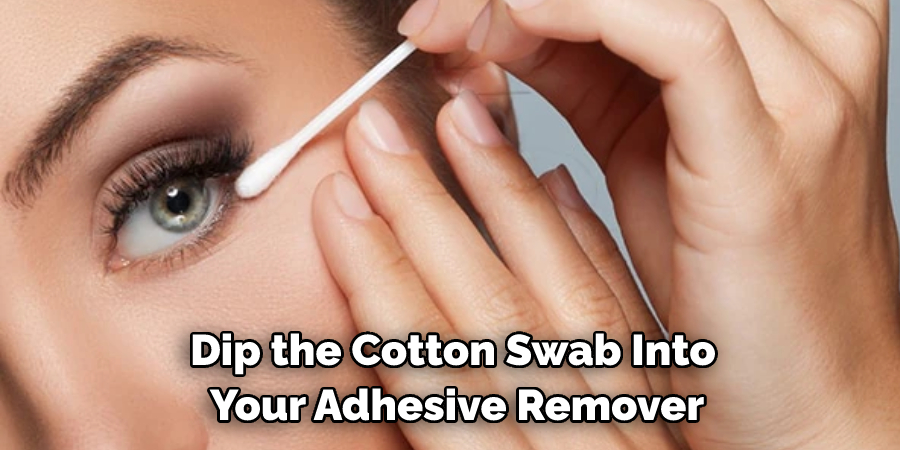 Dip the Cotton Swab Into Your Adhesive Remover