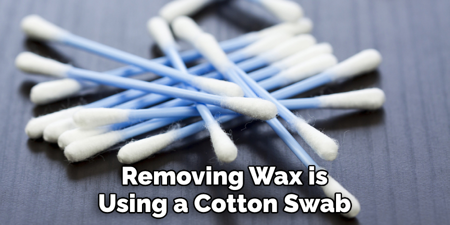 Removing Wax is Using a Cotton Swab