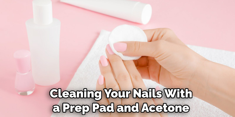  Cleaning Your Nails With a Prep Pad and Acetone