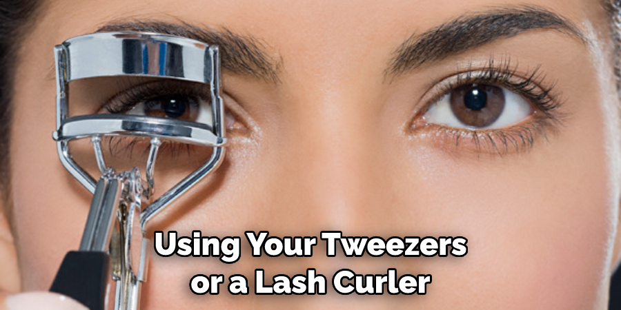 Using Your Tweezers or a Lash Curler