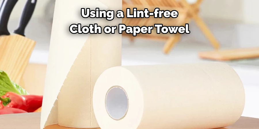 Using a Lint-free 
Cloth or Paper Towel 