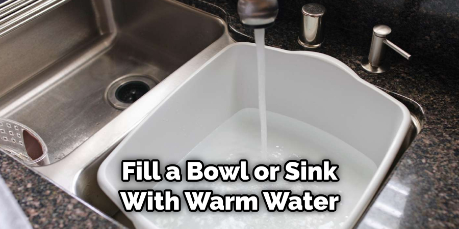 Fill a Bowl or Sink With Warm Water