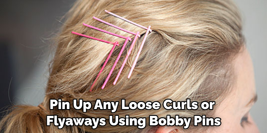 Pin Up Any Loose Curls or Flyaways Using Bobby Pins