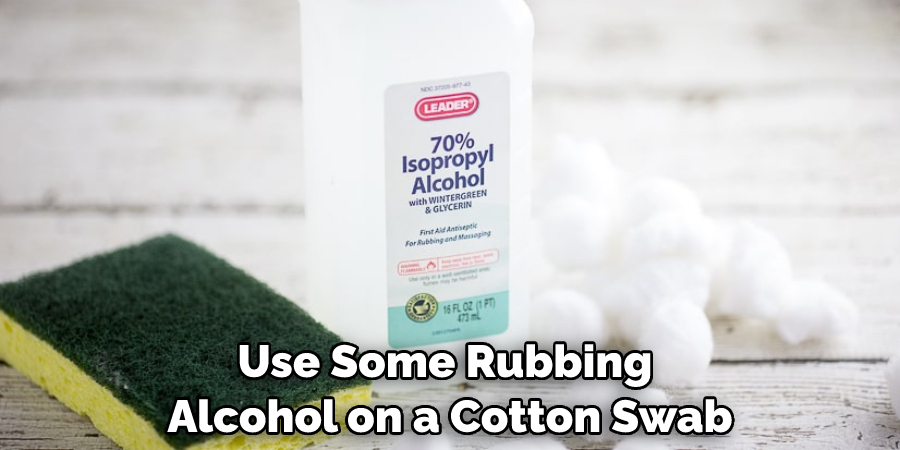 Use Some Rubbing Alcohol on a Cotton Swab