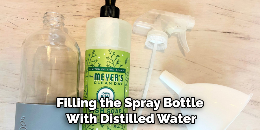 Filling the Spray Bottle With Distilled Water