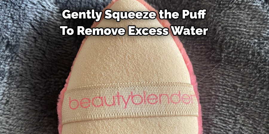 Gently Squeeze the Puff 
To Remove Excess Water