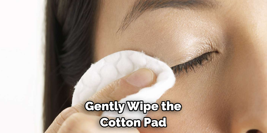 Gently Wipe the Cotton Pad