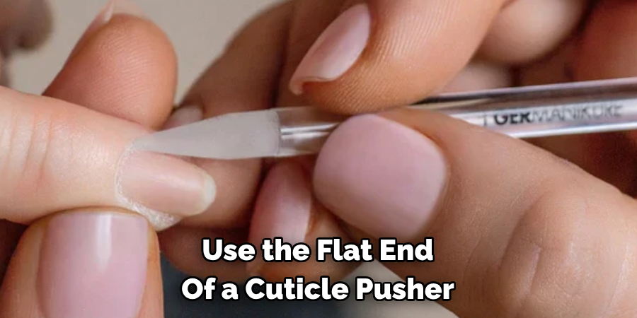 Use the Flat End 
Of a Cuticle Pusher 