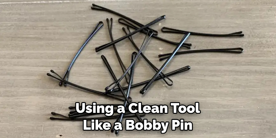 Using a Clean Tool Like a Bobby Pin