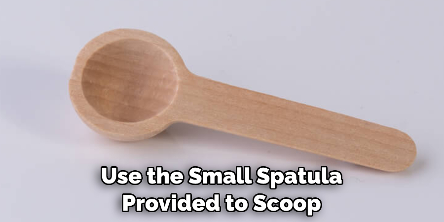 Use the Small Spatula Provided to Scoop