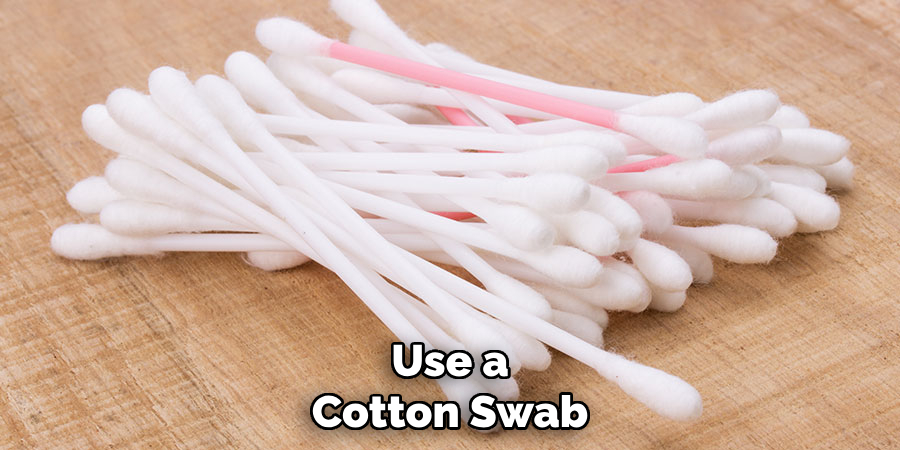 Use a Cotton Swab