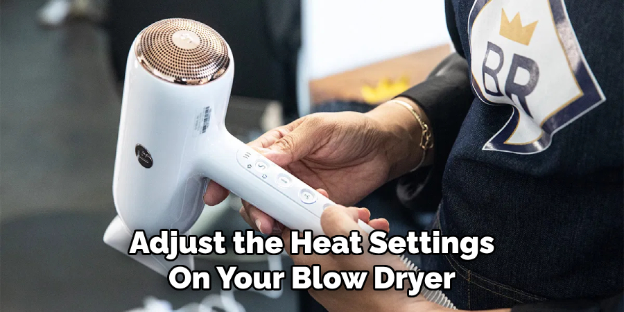 Adjust the Heat Settings
On Your Blow Dryer