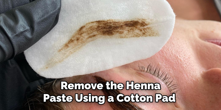 Remove the Henna
Paste Using a Cotton Pad 