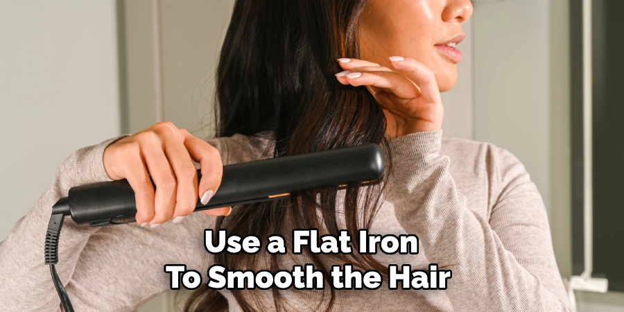 Use a Flat Iron
To Smooth the Hair 