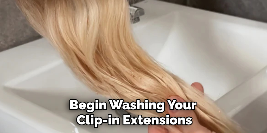 Begin Washing Your 
Clip-in Extensions