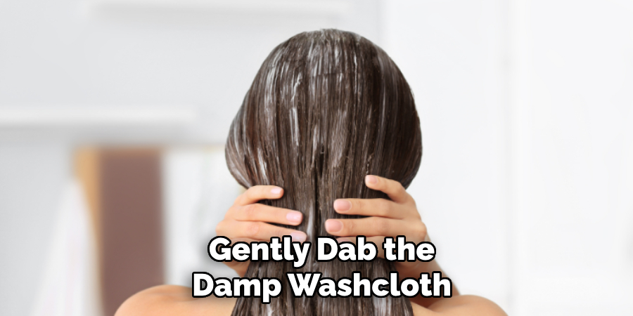 Gently Dab the
Damp Washcloth