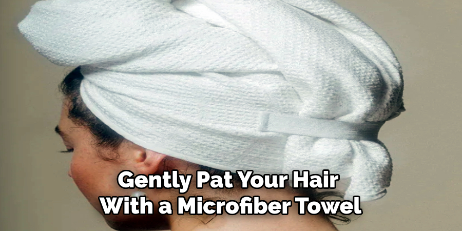 Gently Pat Your Hair 
With a Microfiber Towel