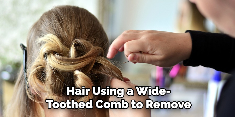 Hair Using a Wide-
Toothed Comb to Remove