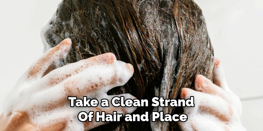 Take a Clean Strand 
Of Hair and Place