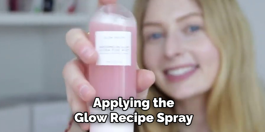 applying the Glow Recipe Spray
