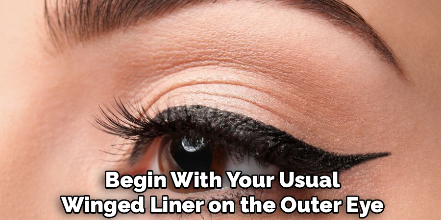 Begin With Your Usual
Winged Liner on the Outer Eye