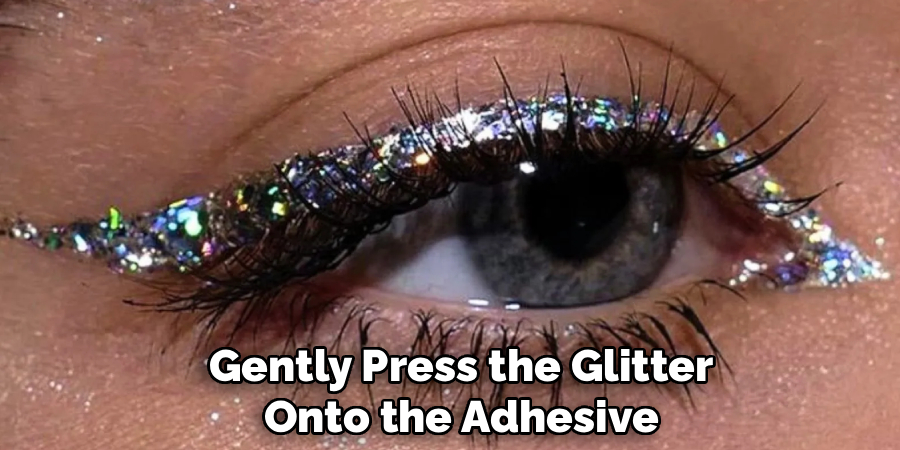 Gently Press the Glitter
Onto the Adhesive