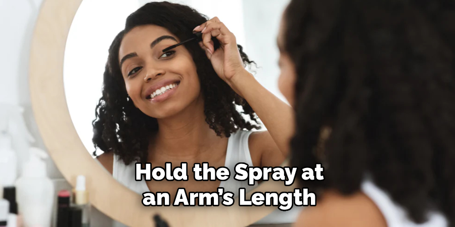 Hold the Spray at
an Arm’s Length