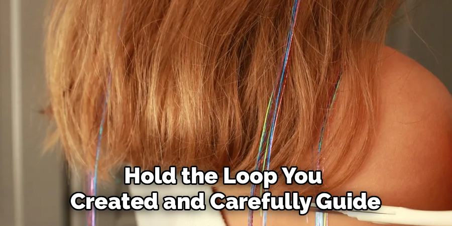 Hold the Loop You 
Created and Carefully Guide