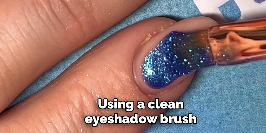 Using a clean 
eyeshadow brush 