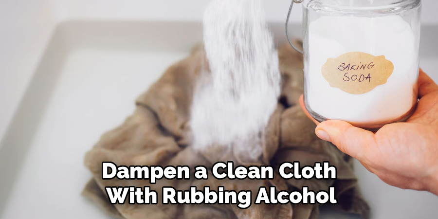 Dampen a Clean Cloth
With Rubbing Alcohol
