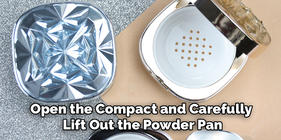 Open the Compact and Carefully 
Lift Out the Powder Pan